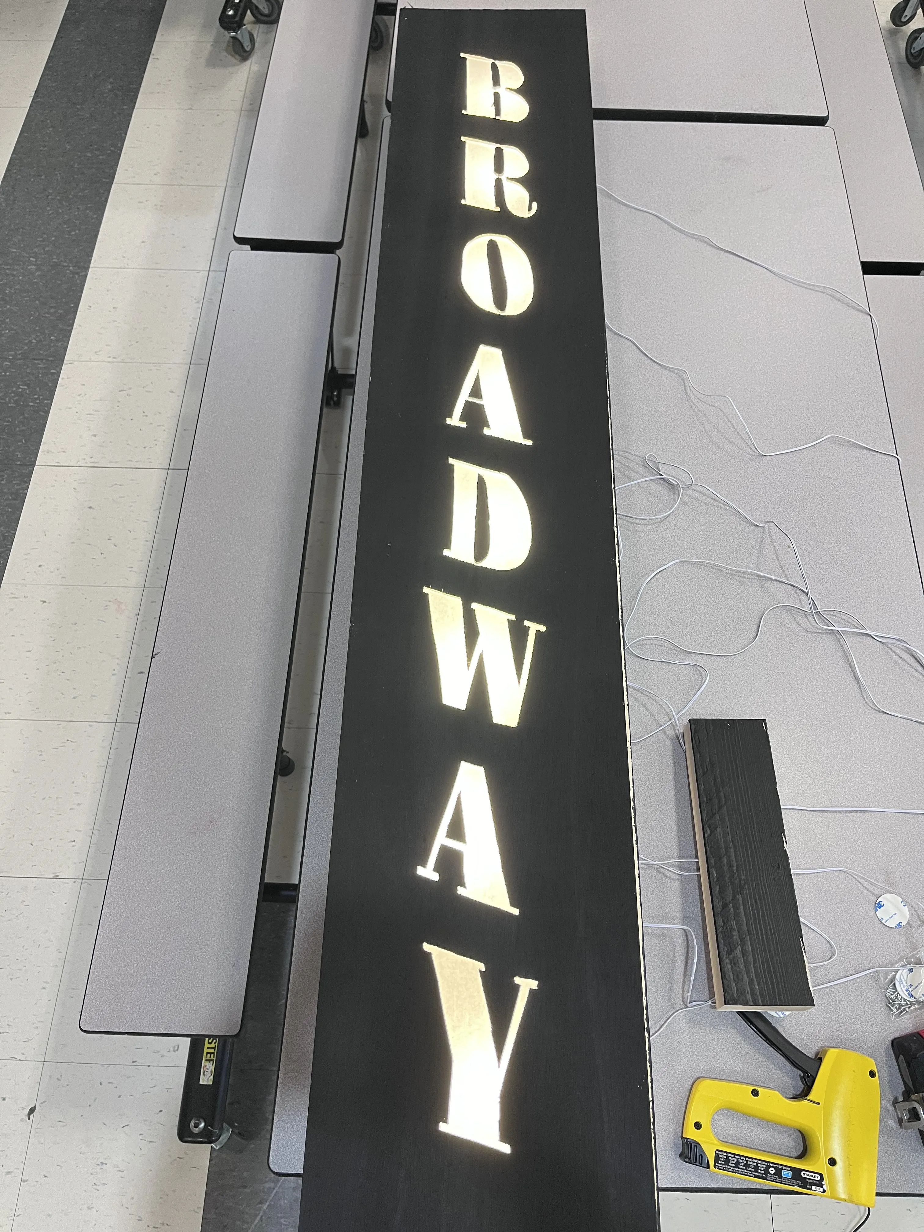 The Broadway sign lit up during construction