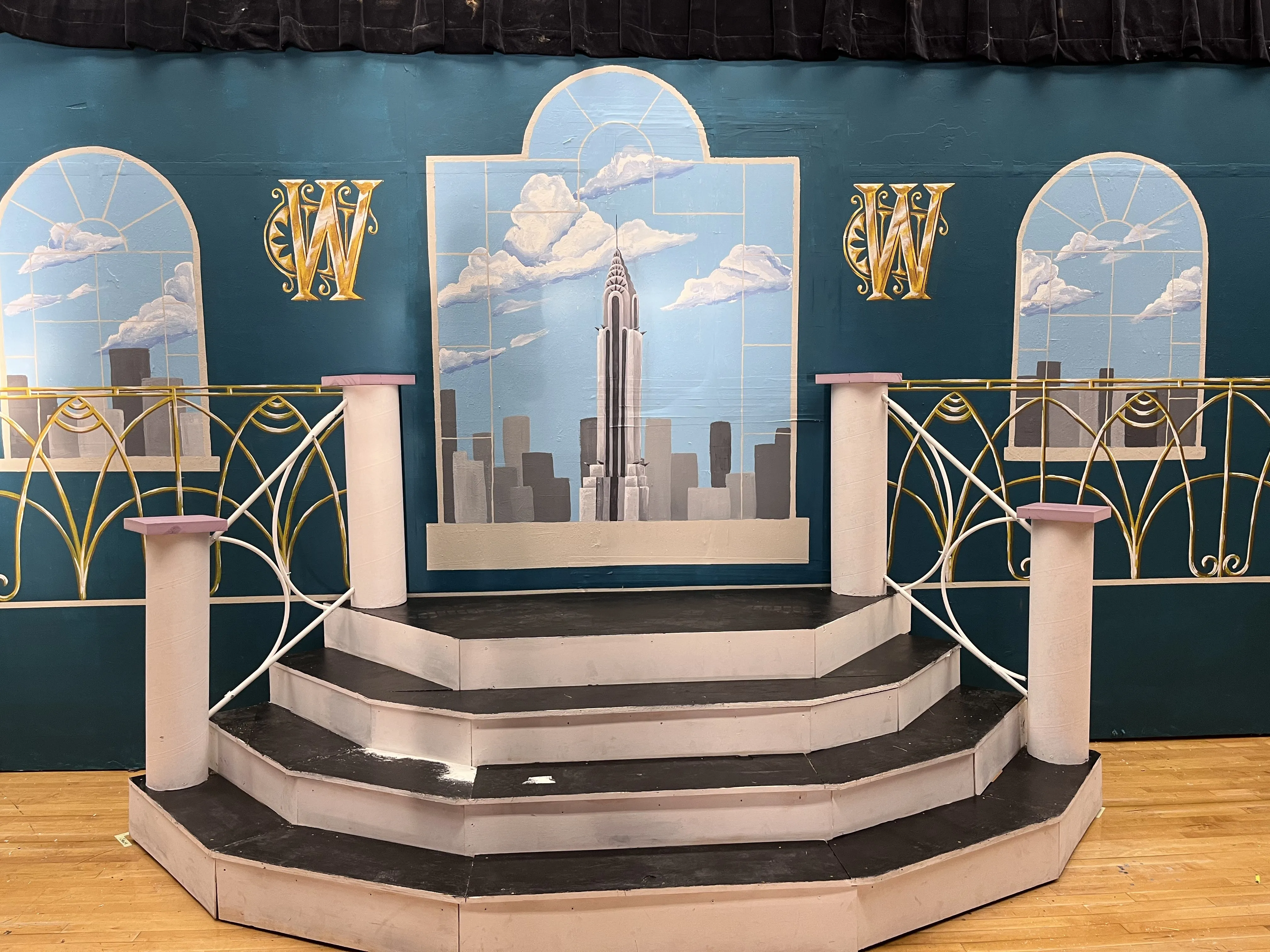 The full Warbucks set with backdrop, staircase, and railing