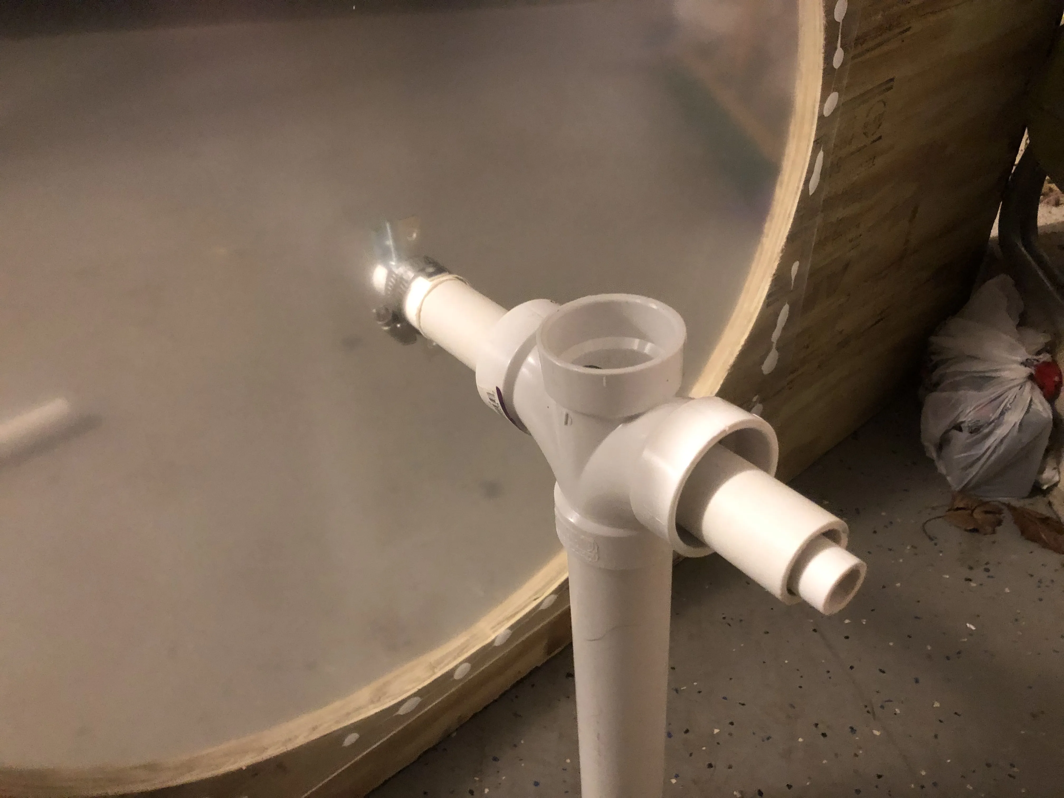 The full PVC pivot assembly with T-junction, built on the garage floor