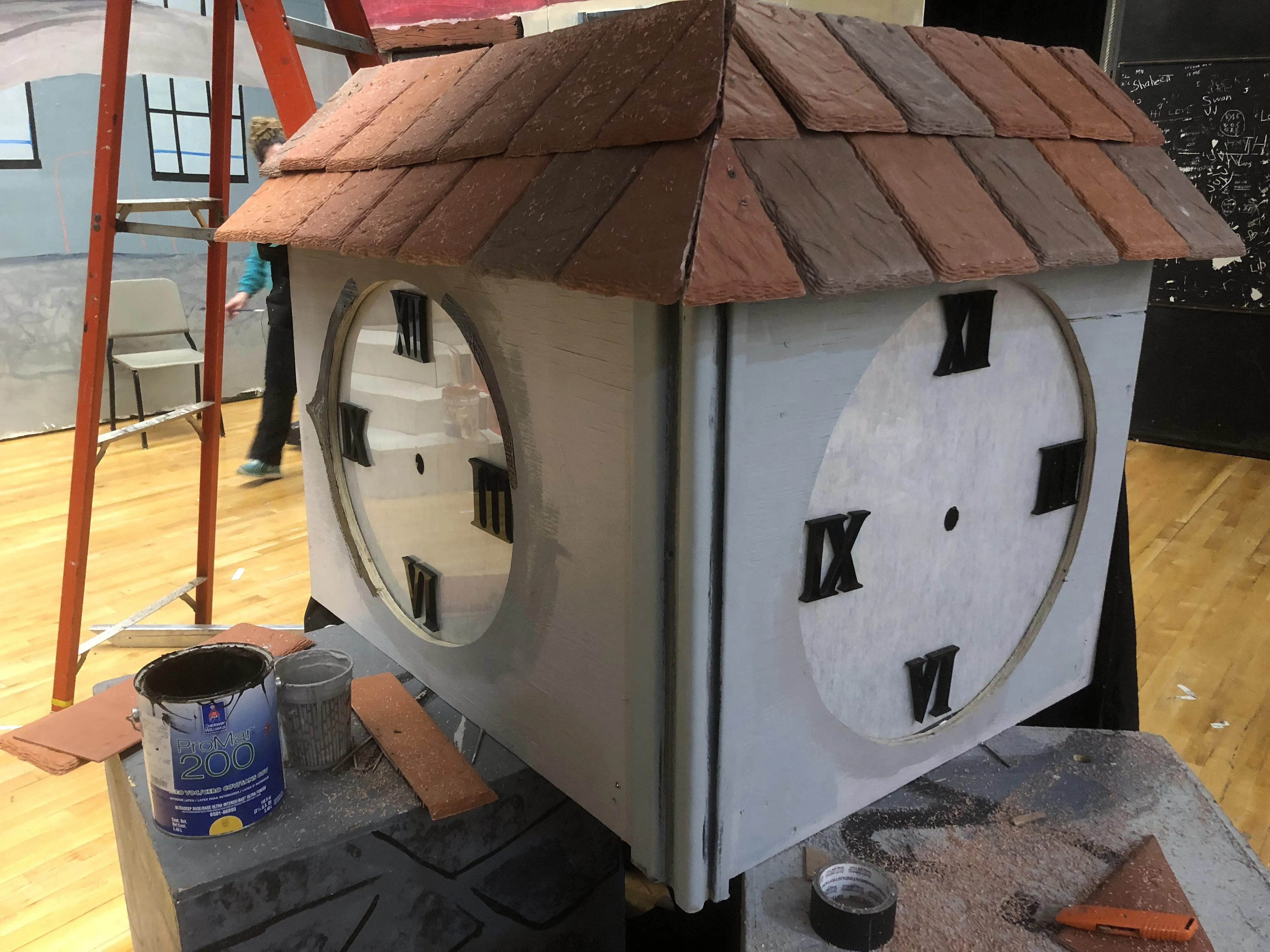 Fitting the clock face panel into the tower during installation