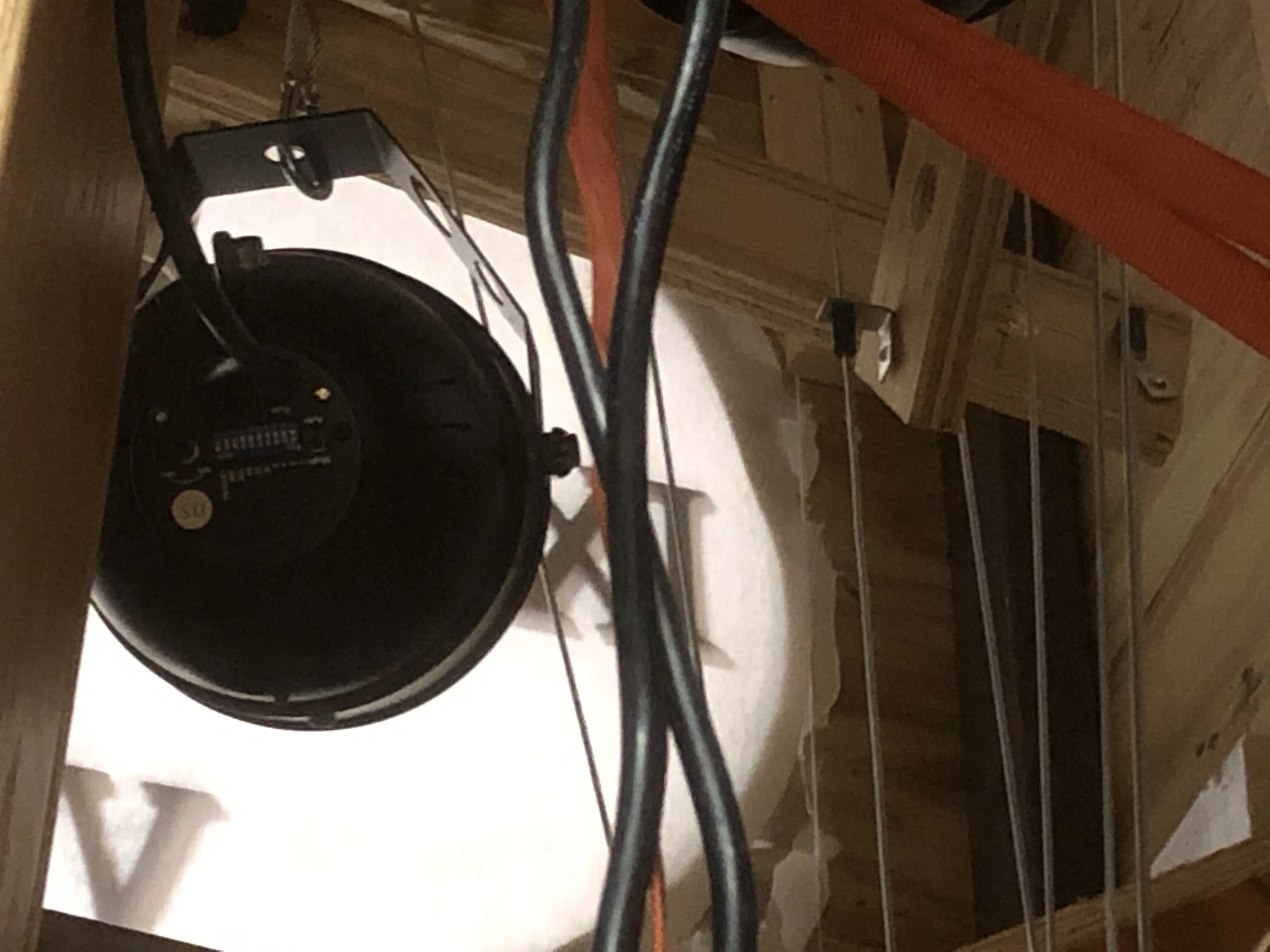 Inside the tower — the PAR light and the counterweight cables running down the sides