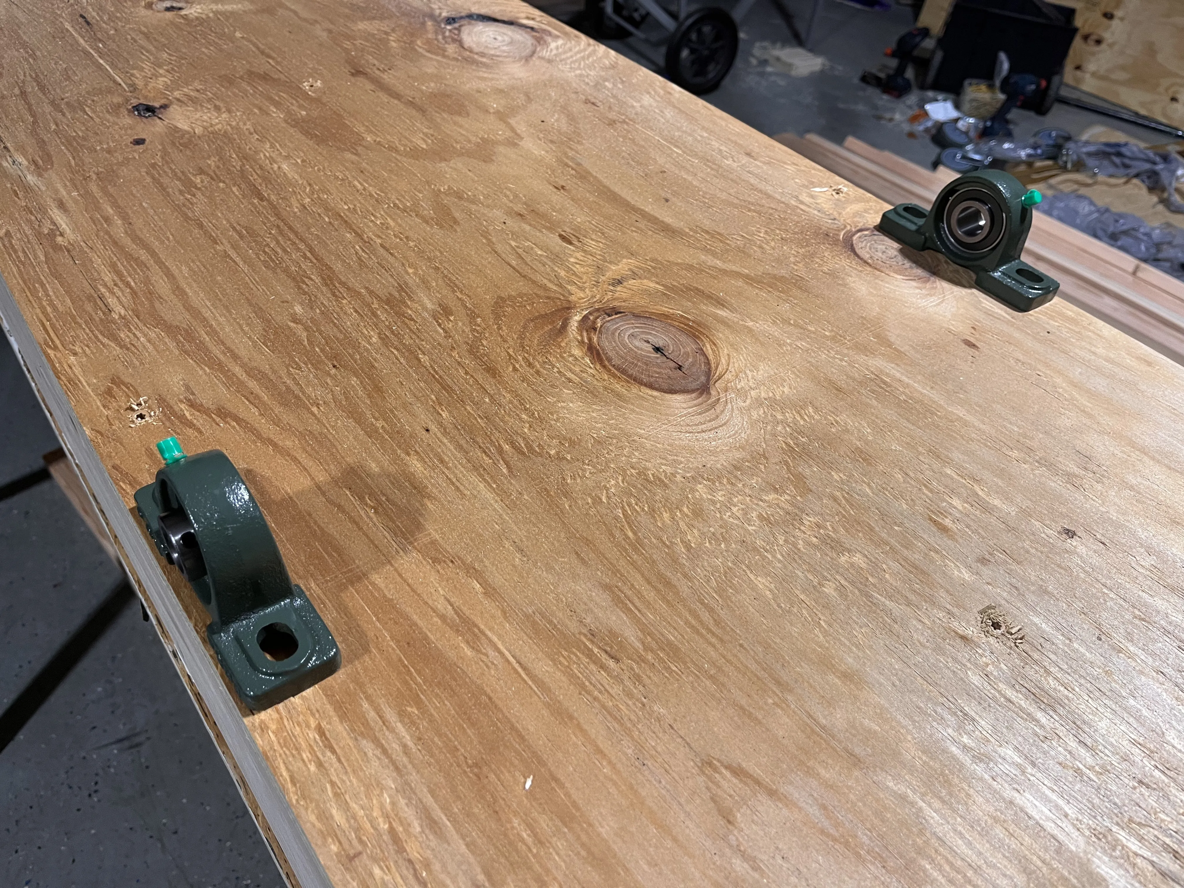 The pillow block bearings mounted to the top of the A-frame