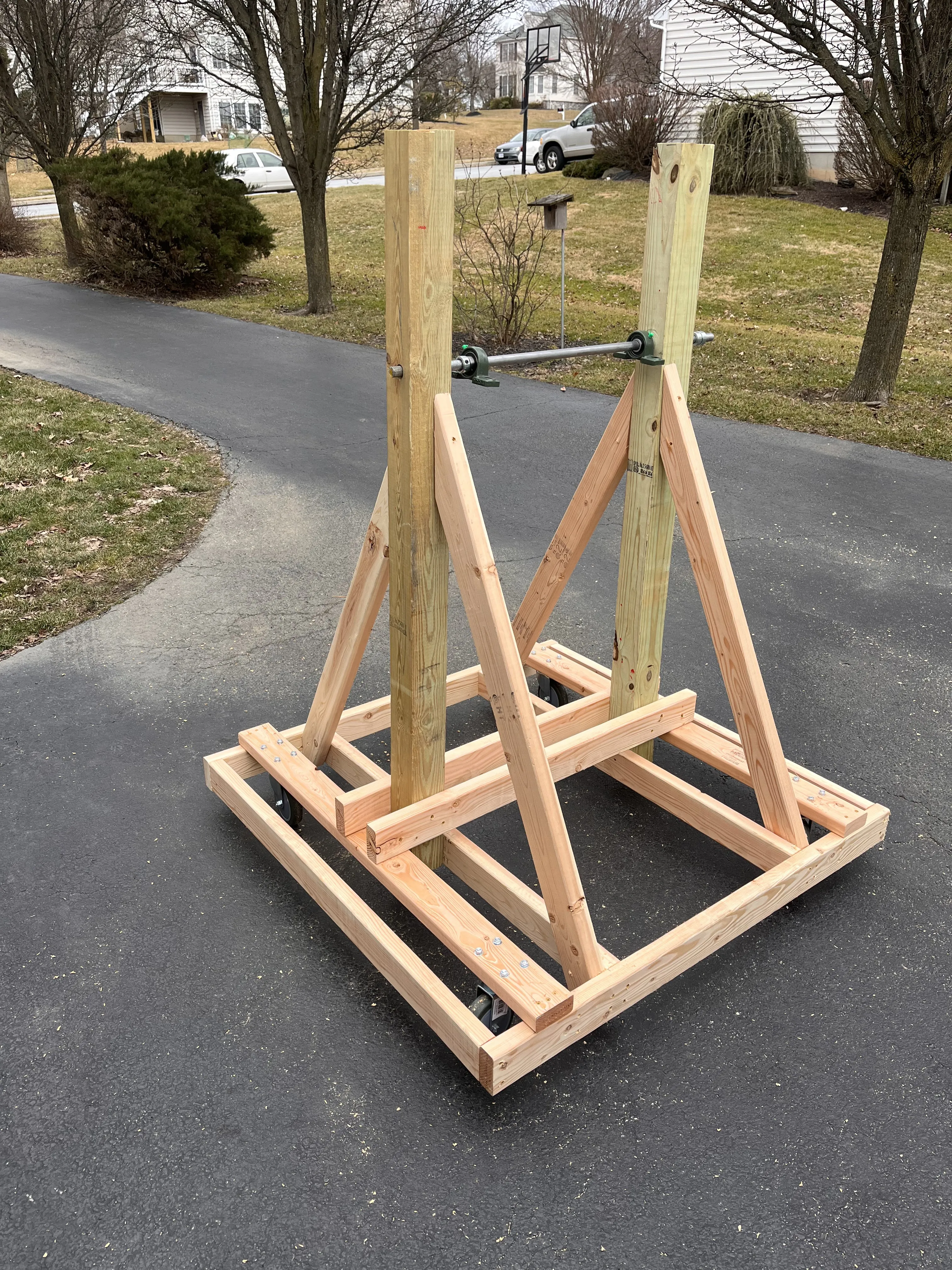 The rig base and A-frame on the driveway, showing the caster wheels