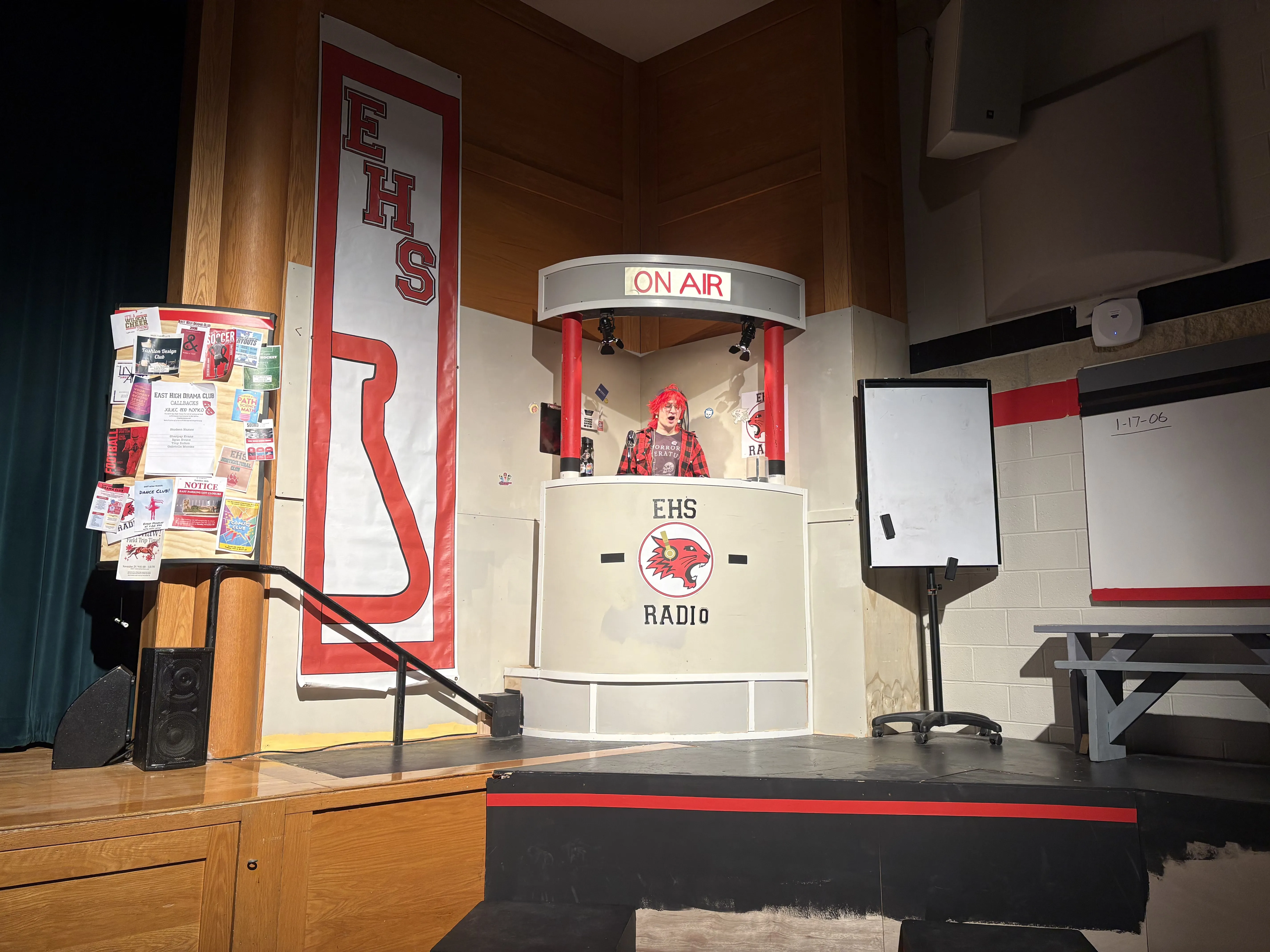 The DJ booth in performance — Jack Scott at the mic, ON AIR sign lit