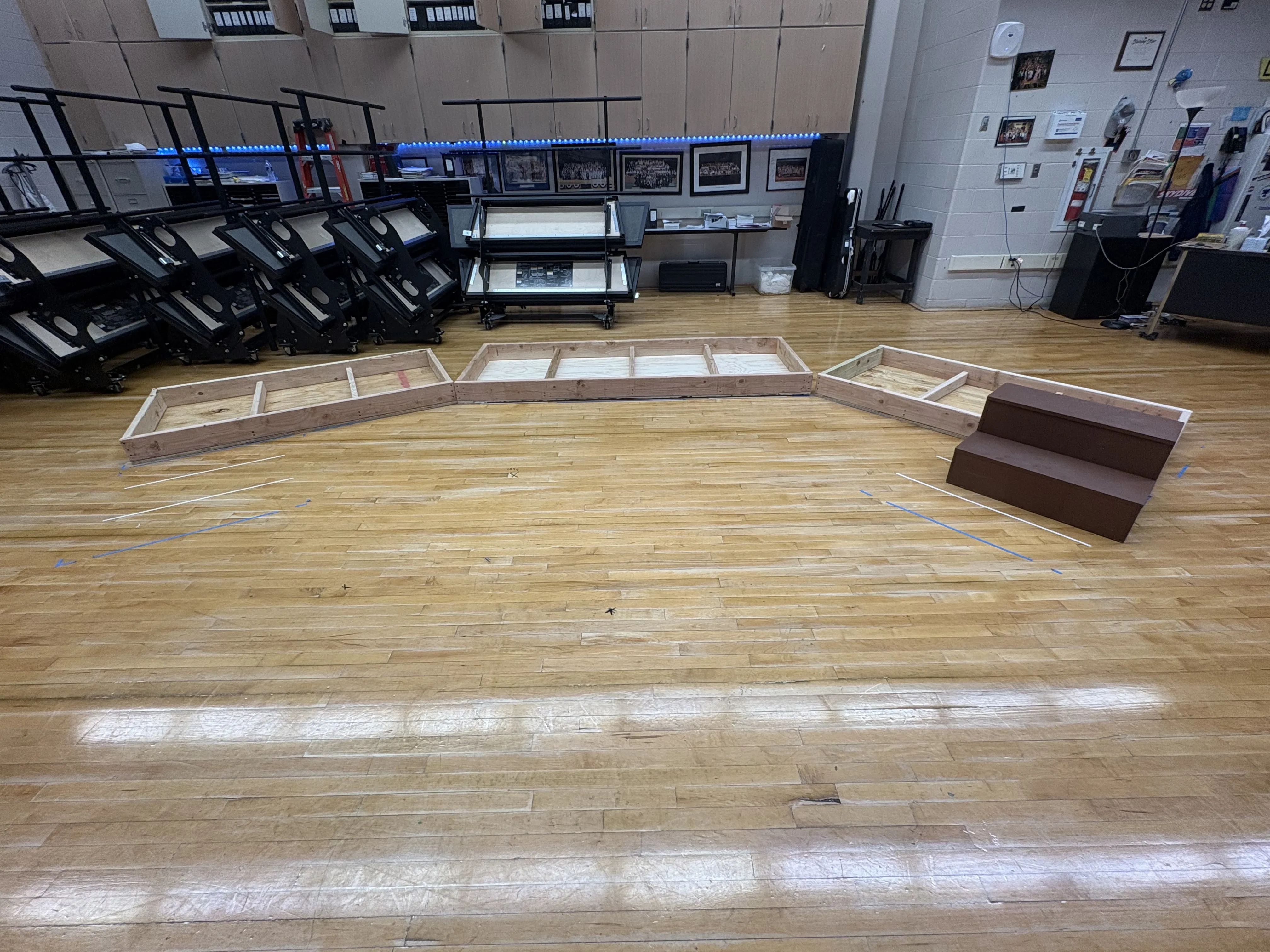 Platform frames laid out on the stage floor during the build