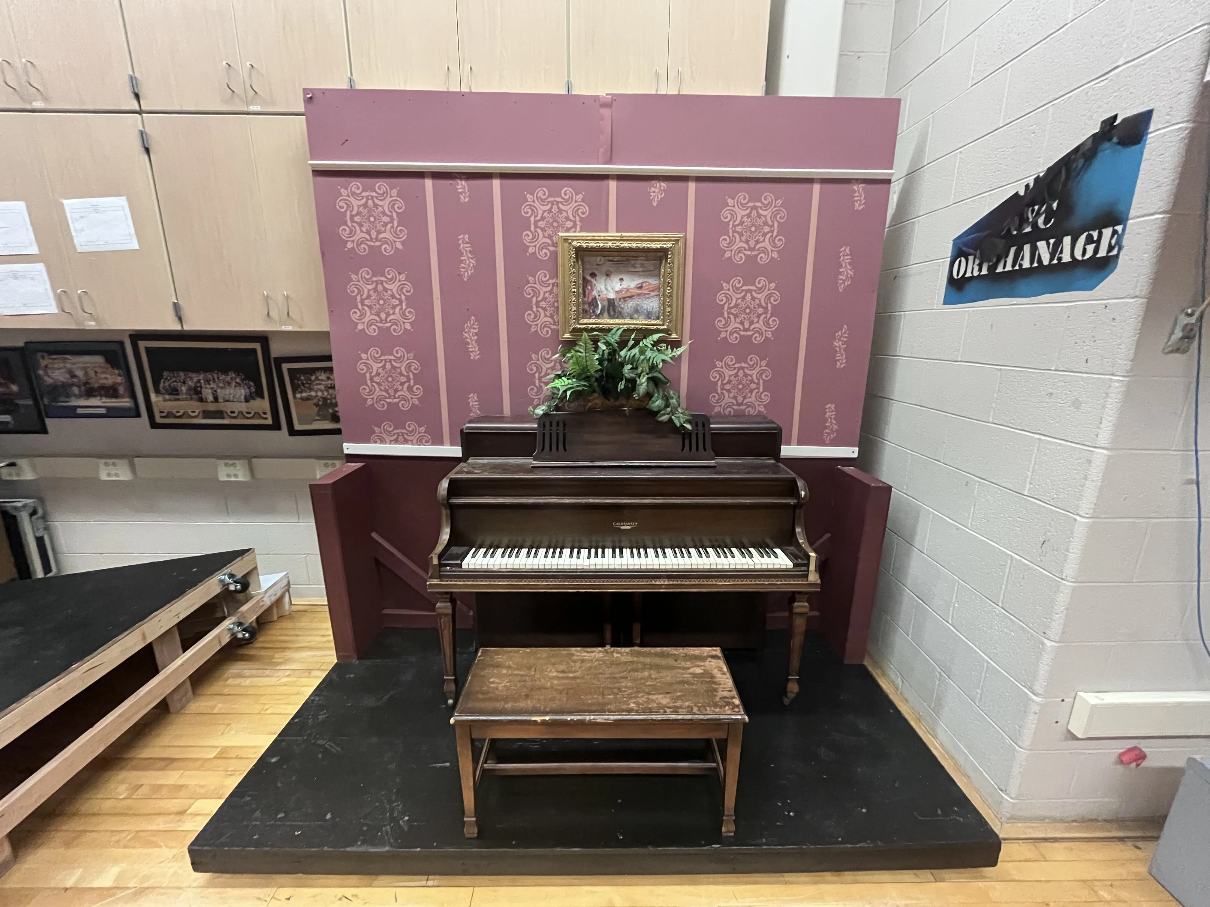 The piano in front of Stephanie's hand-painted Victorian wallpaper backdrop