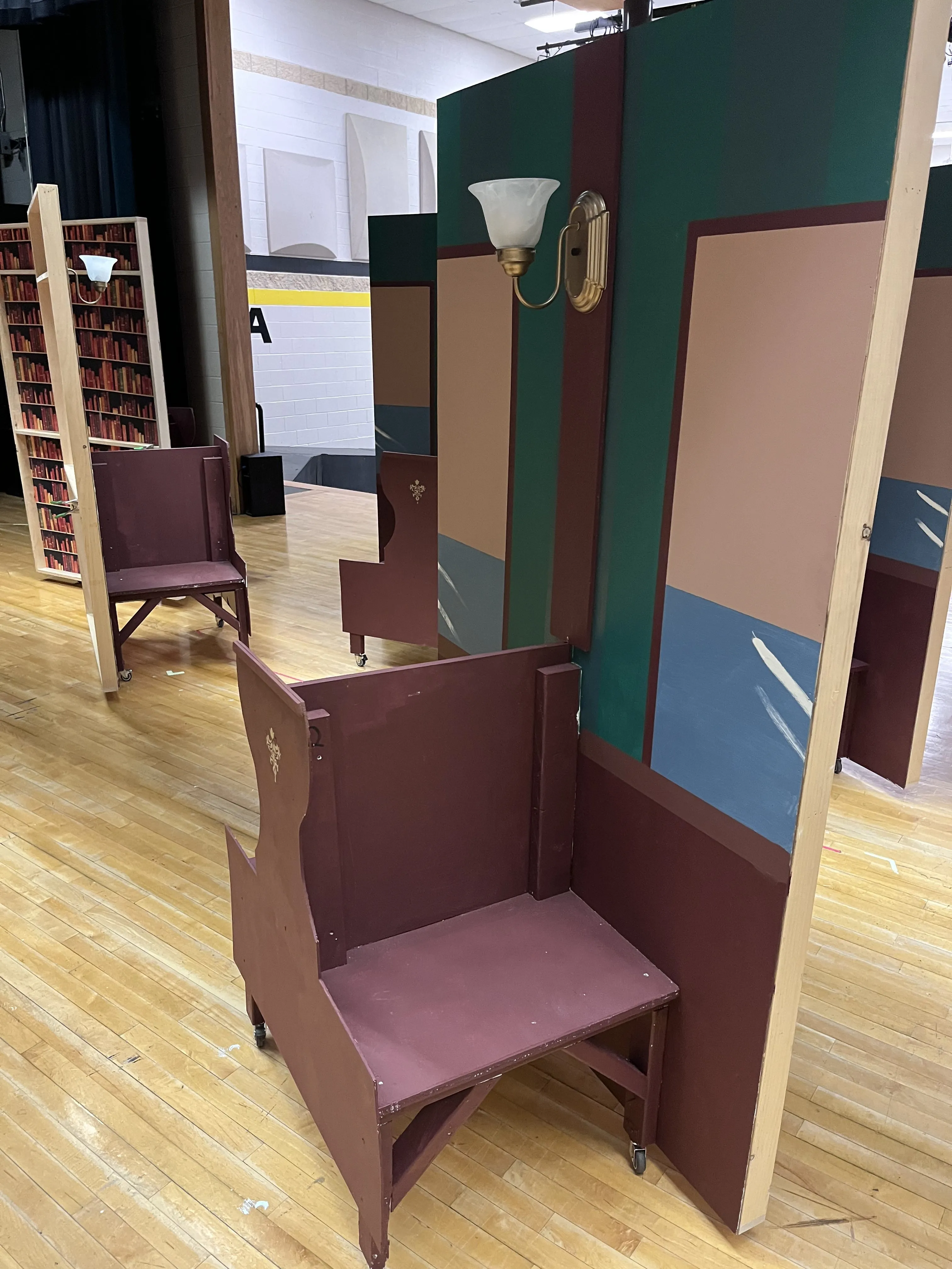 Close-up of a train car — the booth seat and wall sconce