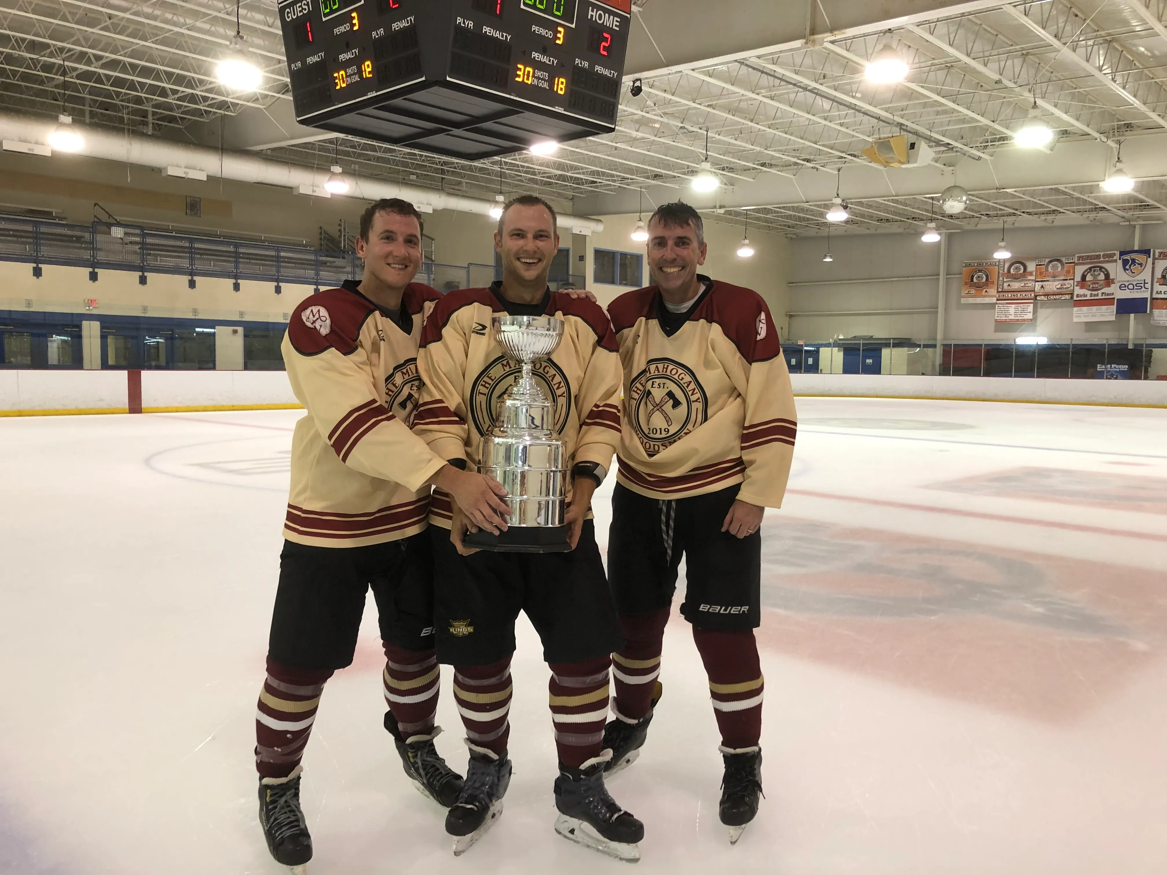 Jim with linemates Tanner and Don after a Woodsmen championship